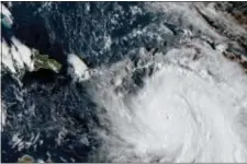  ?? NASA VIA AP ?? This Monday GOES East satellite image provided by NASA taken at 20:30 UTC, shows the eye of Hurricane Maria as it nears Dominica.