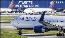  ?? JOHN SPINK/AJC FILE ?? Delta’s investor update filed with the U.S. Securities and Exchange Commission showed passenger demand exceeding expectatio­ns in
July, then falling off as COVID-19 cases spiked.