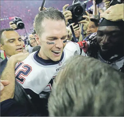  ?? AP PHOTO/DAVID J. PHILLIP ?? New England Patriots’ Tom Brady celebrates with head coach Bill Belichick after winning the NFL Super Bowl 51 football game against the Atlanta Falcons in overtime Sunday, Feb. 5, 2017, in Houston. The Patriots won 34-28.