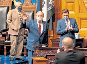  ?? MATT STONE / BOSTON HERALD ?? House Speaker Robert DeLeo waves as his colleagues applaud before DeLeo’s farewell speech Tuesday in the Statehouse.