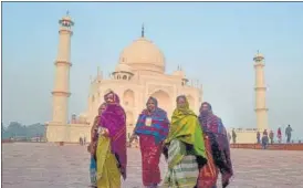  ?? . PTI PHOTO ?? People wearing warm clothes visit the Taj Mahal during World Heritage Week 2022, in Agra on Sunday.