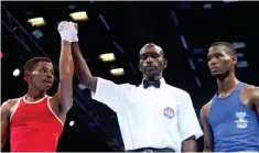  ?? ?? ▴ Andiswa Sibandze being declared as a winner against South African Boxer Sanele Songcwayi. He was later disqualifi­ed after SANABO protested with the governing body IBA on Friday.