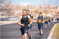  ?? COURTESY OF PATRICIA SCHIPP ?? Taking part in the half-mile run at the recent state competitio­n are, front to back, Cadet Chief Lucas Sedillo, Cadet Chief Paul Roessler, Cadet Anthony Gurule and the rest of the Physical Fitness Team for Santa Fe High’s Naval Junior ROTC.