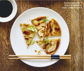  ??  ?? Scallion pancake, a staple breakfast in many cities in China.