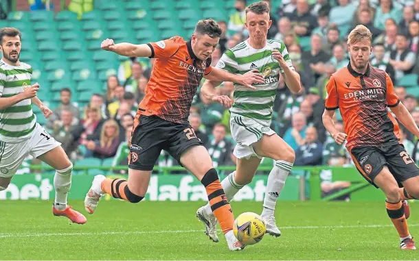  ?? ?? YOUNG STAR: Kerr Smith, in action for Dundee United against Celtic, has made a big money move to English Premier League side Aston Villa.