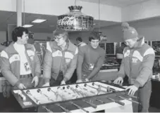  ?? THE ASSOCIATED PRESS FILE ?? Bob Suter, right, plays foosball with U.S. hockey teammates during the 1980 Winter Olympics in Lake Placid, N.Y. Their team won gold that year.