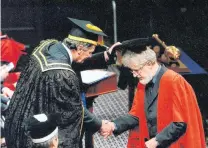  ?? PHOTO: SUPPLIED ?? Further distinctio­n . . . Former Otago University chancellor John Ward confers an honorary doctorate of science on Prof Flynn in May 2010.