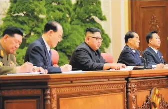  ?? Korean Central News Agency ?? North Korean leader Kim Jong Un attends a meeting Saturday of his ruling Workers’ Party. Kim pledged to build up his country’s nuclear arsenal despite internatio­nal pressure to halt testing.