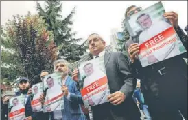  ?? REUTERS ?? Human rights activists and friends of Saudi journalist Jamal Khashoggi hold his pictures during a protest outside the Saudi consulate in Istanbul, Turkey, earlier this week.