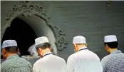  ?? — AP ?? Chinese Hui Muslims pray during Eid al- Fitr prayers at Niujie Mosque in Beijing last month. File photo.