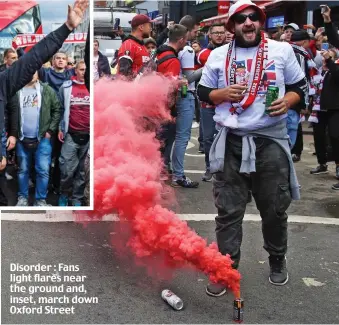  ??  ?? Disorder : Fans light flares near the ground and, inset, march down Oxford Street