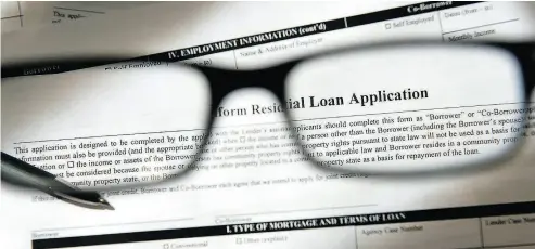  ?? DAVID PAUL MORRIS / BLOOMBERG ?? The arrears rate in Canada is 0.24% of all mortgages, well below the 2.2% foreclosur­e peak of the U.S. housing crisis.