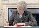  ??  ?? >
PM Theresa May pens her letter to our current EU partners