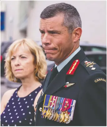  ?? ERROL MCGIHON ?? Maj.-Gen. Dany Fortin, with his wife Madeleine Collin, talks to reporters outside Gatineau police headquarte­rs on Wednesday after turning himself in to face a charge of sexual assault.