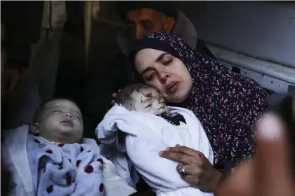  ?? HATEM ALI — THE ASSOCIATED PRESS ?? Rania Abu Anza cradles her twins, who were killed in an Israel strike on a house in Rafah, in the southern Gaza Strip, Sunday, March 3, 2024. Abu Anza and her husband, who was killed in the same strike, spent 10years trying to get pregnant.