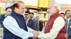  ??  ?? LAHORE: Indian Prime Minister Narendra Modi (right) shakes hands with his Pakistani counterpar­t Nawaz Sharif on Friday. — AFP