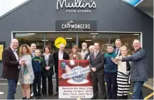  ??  ?? John Mullins and Sharon Murrin, main sponsors, with the dancers.