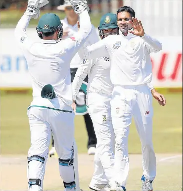  ?? Picture: AFP/GIANLUIGI GUERCIA ?? HIGH FIVES: South African spinner Keshav Maharaj, right, celebrates the dismissal of Bangladesh batsman Sabbir Rahman during the fifth day of the test in Potchefstr­oom yesterday