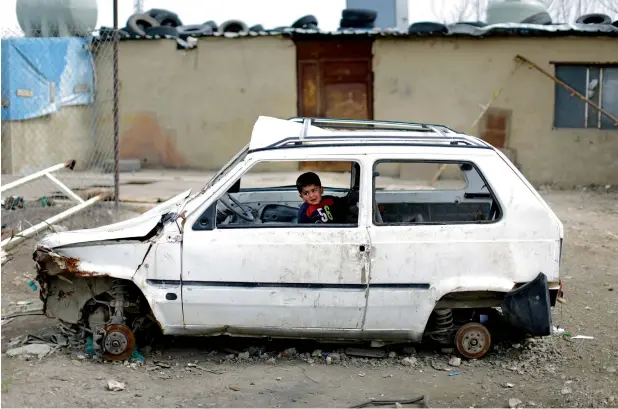  ?? AFP file ?? LEST WE FORGET: A Syrian refugee boy plays inside a ruined car at an informal refugee camp, at Al Marj town in Bekaa valley, east Lebanon. —