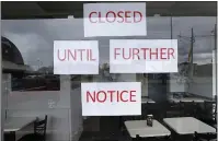  ?? PAUL SANCYA — ASSOCIATED PRESS ?? Some states are starting to allow businesses to reopen. But economists worry it is too soon to safely do so.