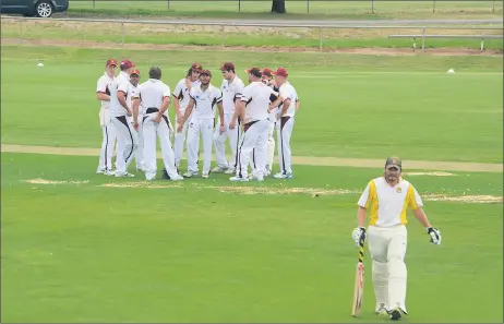  ??  ?? Gone: Cobram batsman Adam Wiffen makes his way off the ground after being dismissed while the Barooga players celebrate.