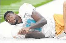  ?? JOE CAVARETTA/STAFF FILE PHOTO ?? DeVante Parker, here stretching in practice, is looking for a 1,000-yard receiving season with the Dolphins.