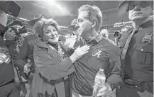  ?? Jamie Squire / Getty Images ?? Alabama coach Nick Saban celebrates with his wife Terry after beating the Georgia Bulldogs to win a sixth championsh­ip.