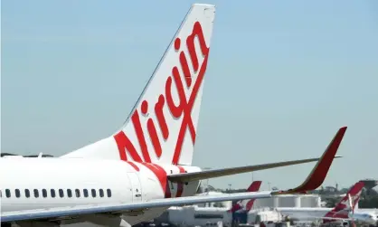  ?? Photograph: Joel Carrett/AAP ?? Virgin Australia and Qantas aircraft at Sydney airport. Virgin has accused Qantas in a letter to the ACCC of a campaign ‘designed to ensure a lessening of competitio­n’.