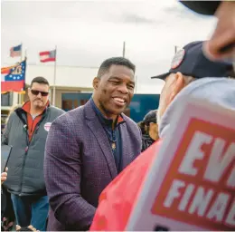  ?? BRANDON BELL/GETTY ?? Republican U.S. Senate candidate Herschel Walker greets supporters Wednesday in McDonough, Ga.