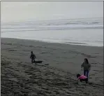  ?? RUTH SCHNEIDER — THE TIMES-STANDARD ?? Visitors to Fairhaven beach on the Samoa peninsula play early on a Sunday afternoon. King tides early this week will bring bigger than normal tides to North Coast beaches.