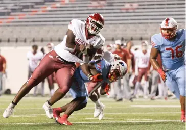  ?? (Arkansas Democrat-gazette/justin Cunningham) ?? Arkansas High's Kence Griffin puts on a big hit on a Little Rock Parkview player on Friday, Oct. 13, 2023, at War Memorial Stadium in Little Rock.