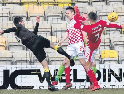  ?? Picture: SNS. ?? Livingston striker Ryan Hardie fires home in the 4-1 victory over St Mirren last week.