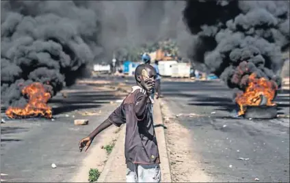  ?? Photo: AFP ?? Burning issues: Residents clashed with police in Bulawayo and Harare on Wednesday during a nationwide shutdown protesting corrupt police, import restrictio­ns, unpaid salaries and a currency shortage.