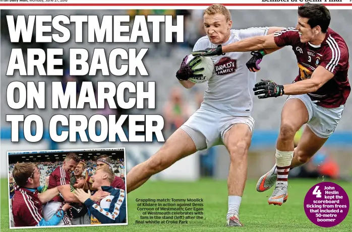  ?? SPORTSFILE ?? Grappling match: Tommy Moolick of Kildare in action against Denis Corroon of Westmeath; Ger Egan of Westmeath celebrates with fans in the stand (left) after the final whistle at Croke Park