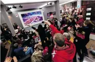  ?? WINSTON CHOW/ CANADIAN OLYMPIC COMMITTEE ?? Fans in Canada House cheer Canada’s team.