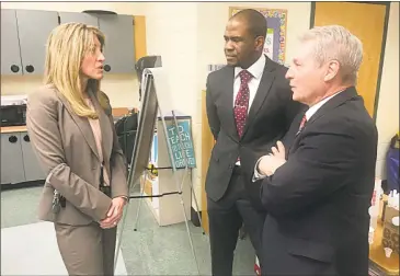  ?? Cassandra Day / Hearst Connecticu­t Media ?? Middletown Superinten­dent of Schools Michael T. Conner, center, speaks with Wilbert Snow Elementary School Principal Jennifer Cannata, left, and state Sen. Len Suzio last month during a visit by Sandy Hook mother and Choose Love Enrichment Program...