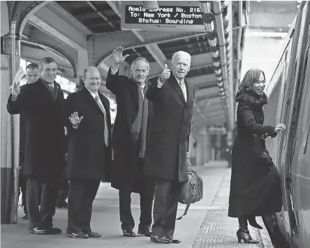  ?? WILLIAM BRETZGER/ USA TODAY NETWORK ?? Delaware Gov. John Carney, left, Sens. Chris Coons and Tom Carper, President Joe Biden and Rep. Lisa Blunt Rochester board a train bound for Wilmington, Del., after inaugurati­on events Jan. 20.