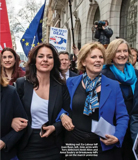  ??  ?? Walking out: Ex-Labour MP Joan Ryan, left, links arms with Tory defectors Heidi Allen and Anna Soubry as breakaway MPs go on the march yesterday