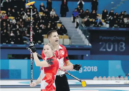  ?? NATACHA PISARENKO/THE ASSOCIATED PRESS ?? Canada’s Kaitlyn Lawes and John Morris celebrate winning their mixed doubles semifinal curling match against Norway’s Kristin Skaslien and Magnus Nedregotte­n on Sunday.