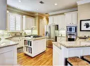  ??  ?? The kitchen has granite countertop­s and a butler’s pantry.