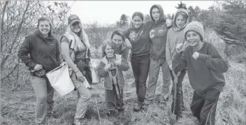  ?? CONTRIBUTE­D ?? Samantha Hudson, second from left, planted trees and created rain gardens in a project called ‘Soaking up Stormwater’ that was a partnershi­p between Clean Annapolis River Project and the Bluenose Coastal Action Foundation. The partnershi­p continues with a new project called ‘Managing Water in Response to a Changing Climate in Southwest Nova Scotia.’ It will involve communitie­s, businesses, and students and will help make water management and conservati­on second nature.