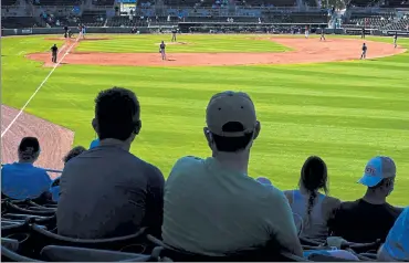  ?? AP ?? Fans watch the Atlanta Braves and the Boston Red Sox play during spring training on Monday.