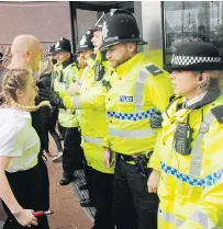  ??  ?? Officers block the entrance. Right, Alfie in hospital