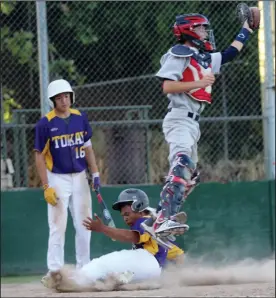  ?? MIKE BUSH/NEWS-SENTINEL ?? Tokay's Cory Glasgow slides safely into home plate while West catcher Dillon Duarte leaps into the air to snag the ball in Tuesday's TCAL baseball game at Zupo Field. Watching is Tokay's Ryan Lew.