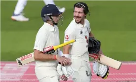  ??  ?? Rory Burns (right) and Joe Root walk off after England declared on 226 for two at Old Trafford, with Burns having contribute­d 90. Photograph: Reuters