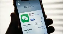  ?? DREW ANGERER/GETTY IMAGES/TNS 2020 ?? The Trump administra­tion tried to ban the Wechat app last fall, saying it posed threats to national security because it collects “vast swaths” of data on users.