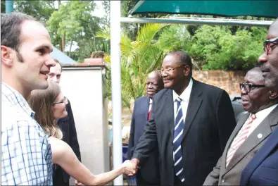  ?? — Picture by Justin Mutenda ?? ZANU-PF Politburo members (from right) Dr David Parirenyat­wa,Cdes Simon Khaya Moyo, Obert Mpofu and Tshinga Dube console Mr Talfin Stamps (left), son of national hero Dr Timothy Stamps, and daughter-in-law Alice at their plot in Goromonzi yesterday.