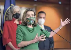  ?? J. Scott Applewhite / Associated Press ?? Speaker Nancy Pelosi, D-calif., speaks to reporters before the House passed a $1.9 trillion pandemic relief package.