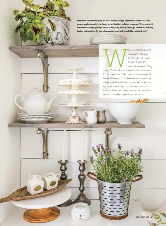  ??  ?? Beth added open shelves above the cubes for extra storage. The shelves also serve the same purpose as a hutch might—to display her pretty dishes and other serveware. “It’s so wonderful to have more storage space and a place to display my dishware,” she says. “I didn’t buy anything to place on the shelves. My poor kitchen cabinets and attic were holding plenty already.”