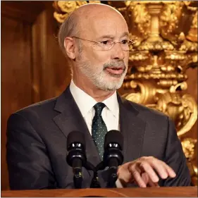  ?? ASSOCIATED PRESS ?? Pennsylvan­ia Gov. Tom Wolf speaks to reporters during a news conference on his signing an executive order for his administra­tion to start working on regulation­s to bring Pennsylvan­ia into a nine-state consortium that sets a price and limits on greenhouse gas emissions from power plants on Oct. 3in Harrisburg. The move is part of Wolf’s effort to fight climate change in the nation’s fourth-biggest emitter of greenhouse gases.